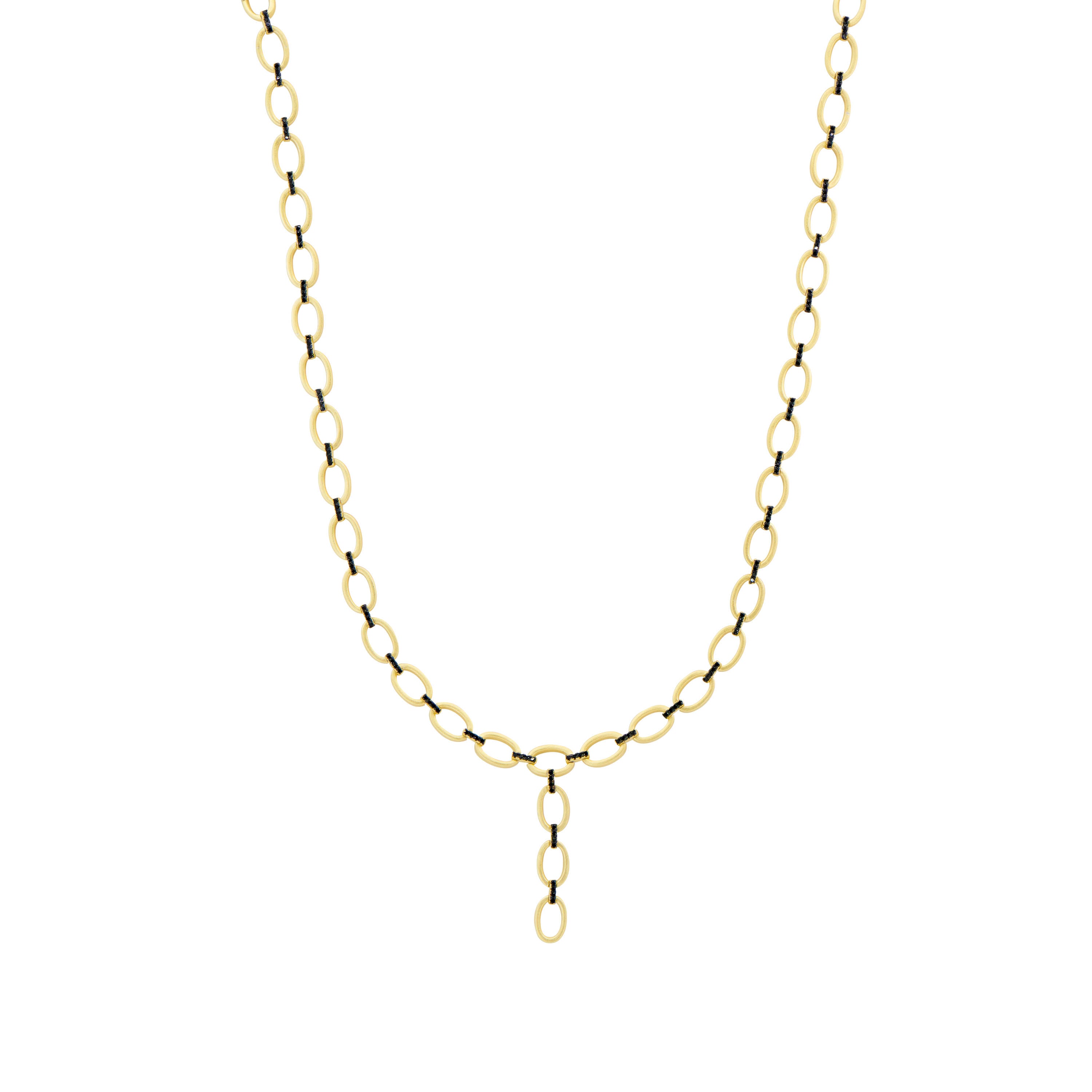 The Industrial Finish Cobblestone Flat Chain Link Y-Necklace showcases a series of elegant oval links, highlighted by a central dangling, smaller oval link charm. This necklace radiates sophistication with its timeless design and is further enriched by its sterling silver accents.