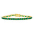The Midnight Tri-Tone Twilight Tennis Bracelet by Midnight showcases a stunning array of round, vivid green gemstones set continuously in 14K matte gold. The secure clasp adds a decorative touch that complements the bracelet&